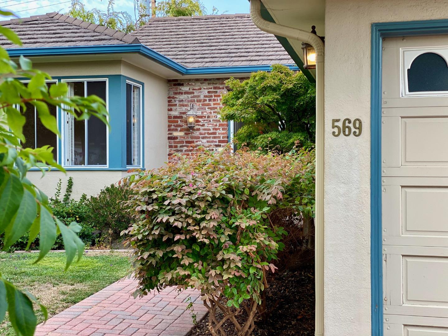 569 Alhambra Road San Mateo, CA 94402 - Photo 4 of 30 a view of a house with potted plants
