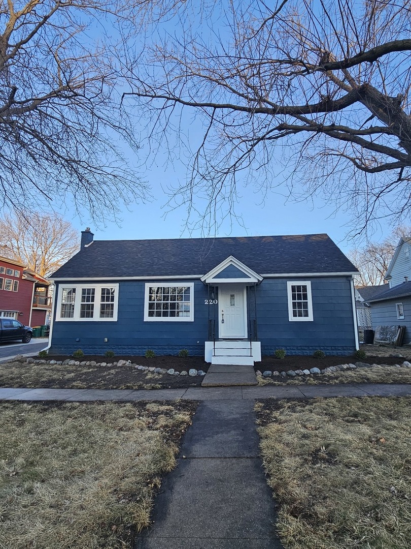 a house that has a tree in front of it
