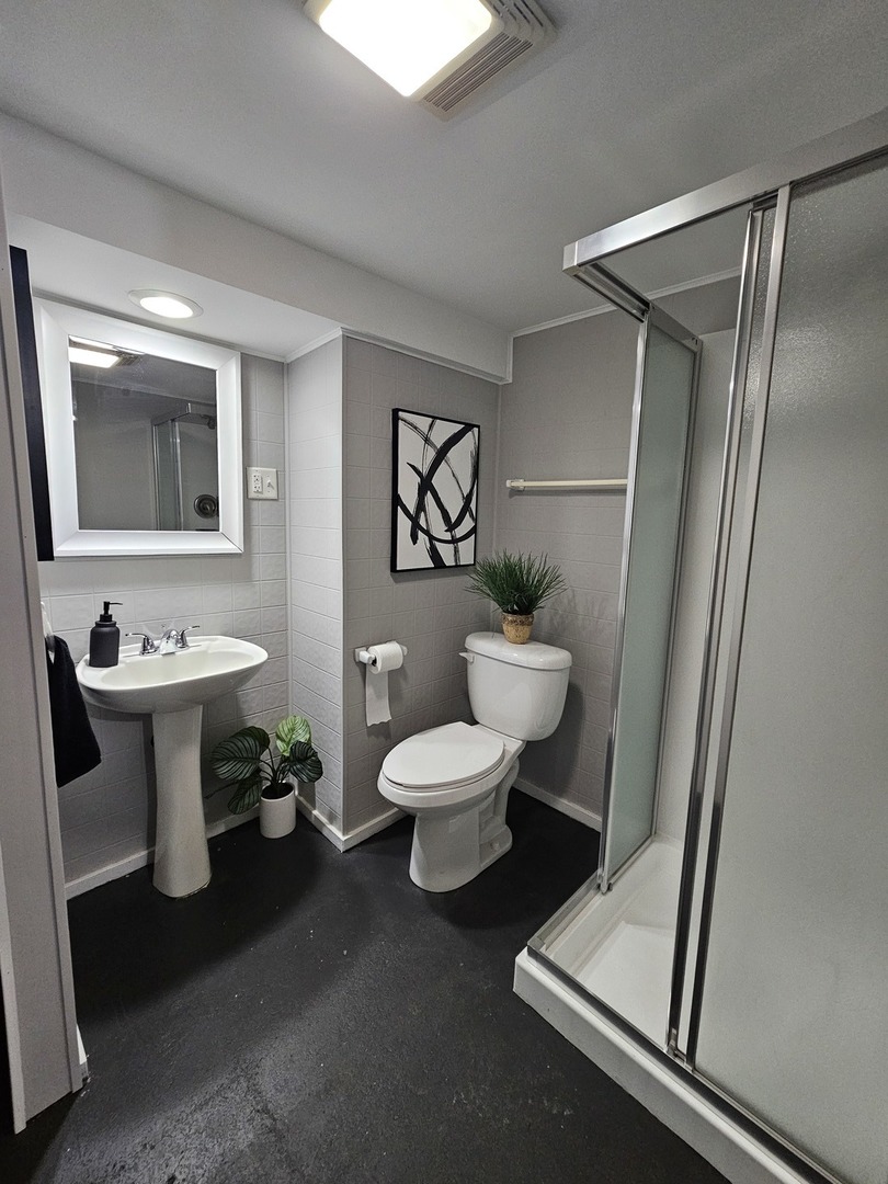 220 South Walnut Street Sycamore, IL 60178 - Photo 13 of 13 a bathroom with a sink a toilet and shower