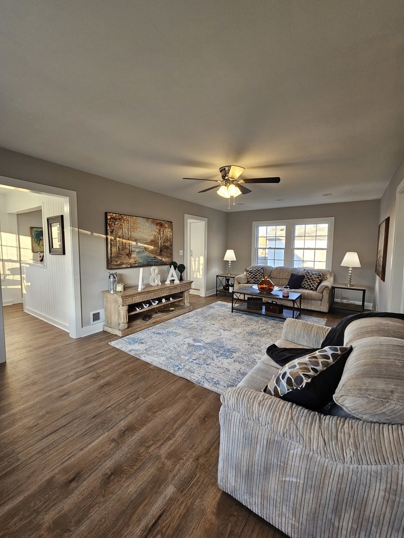 220 South Walnut Street Sycamore, IL 60178 - Photo 2 of 13 a living room with furniture and a flat screen tv