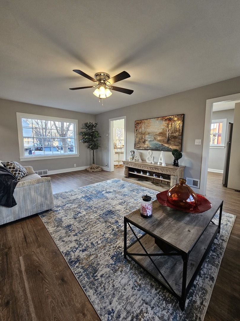 220 South Walnut Street Sycamore, IL 60178 - Photo 3 of 13 a living room with furniture and a flat screen tv