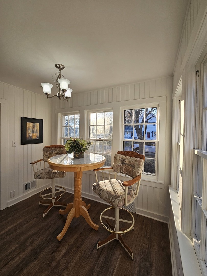 220 South Walnut Street Sycamore, IL 60178 - Photo 6 of 13 a view of a dining room with furniture and wooden floor