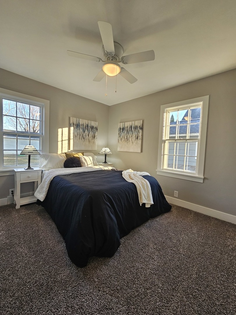 220 South Walnut Street Sycamore, IL 60178 - Photo 8 of 13 a bedroom with a large bed and a window