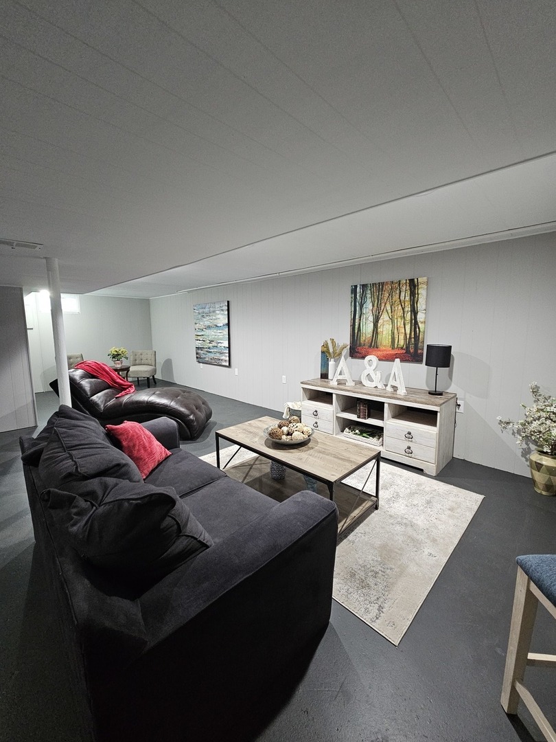 220 South Walnut Street Sycamore, IL 60178 - Photo 10 of 13 a living room with furniture and a rug