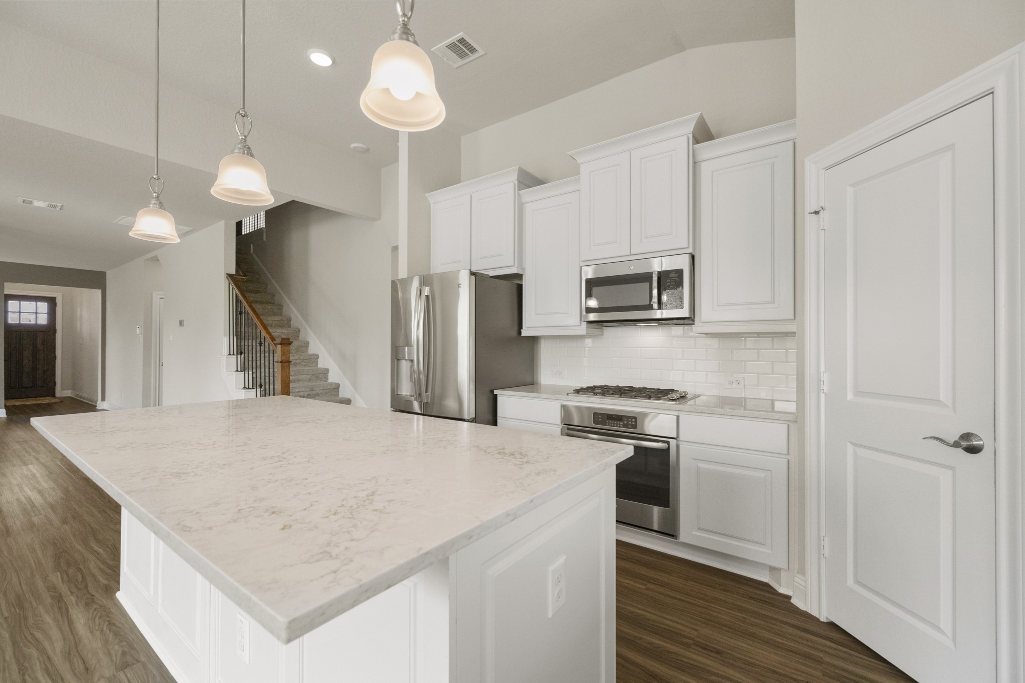 7502 Windsor Park Court Spring, TX 77379 - Photo 14 of 50 a kitchen with kitchen island a sink stainless steel appliances and cabinets