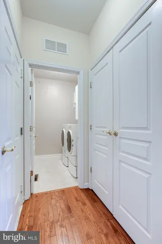 a view of a storage and utility room with washer and dryer