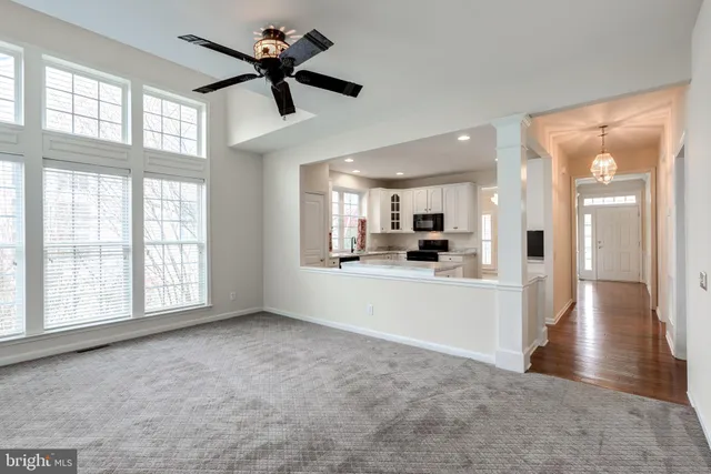 a view of a livingroom with a fireplace and window
