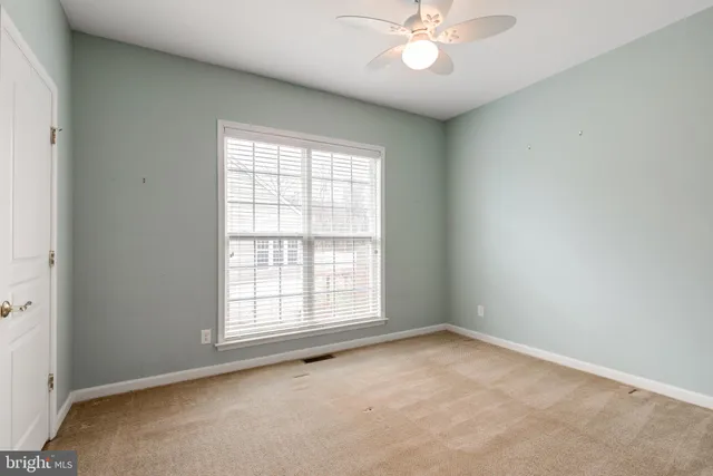 a bathroom with a sink a toilet and shower curtain