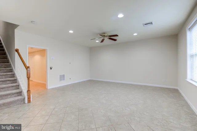 a kitchen with stainless steel appliances granite countertop a sink and a microwave