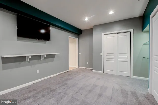 a view of a yard with wooden fence