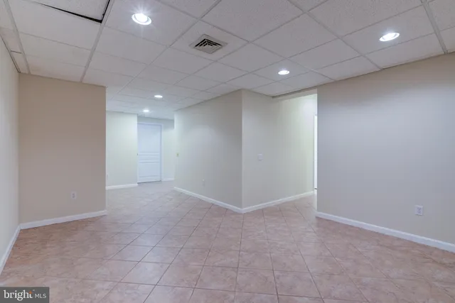 a view of a house with deck and wooden floor