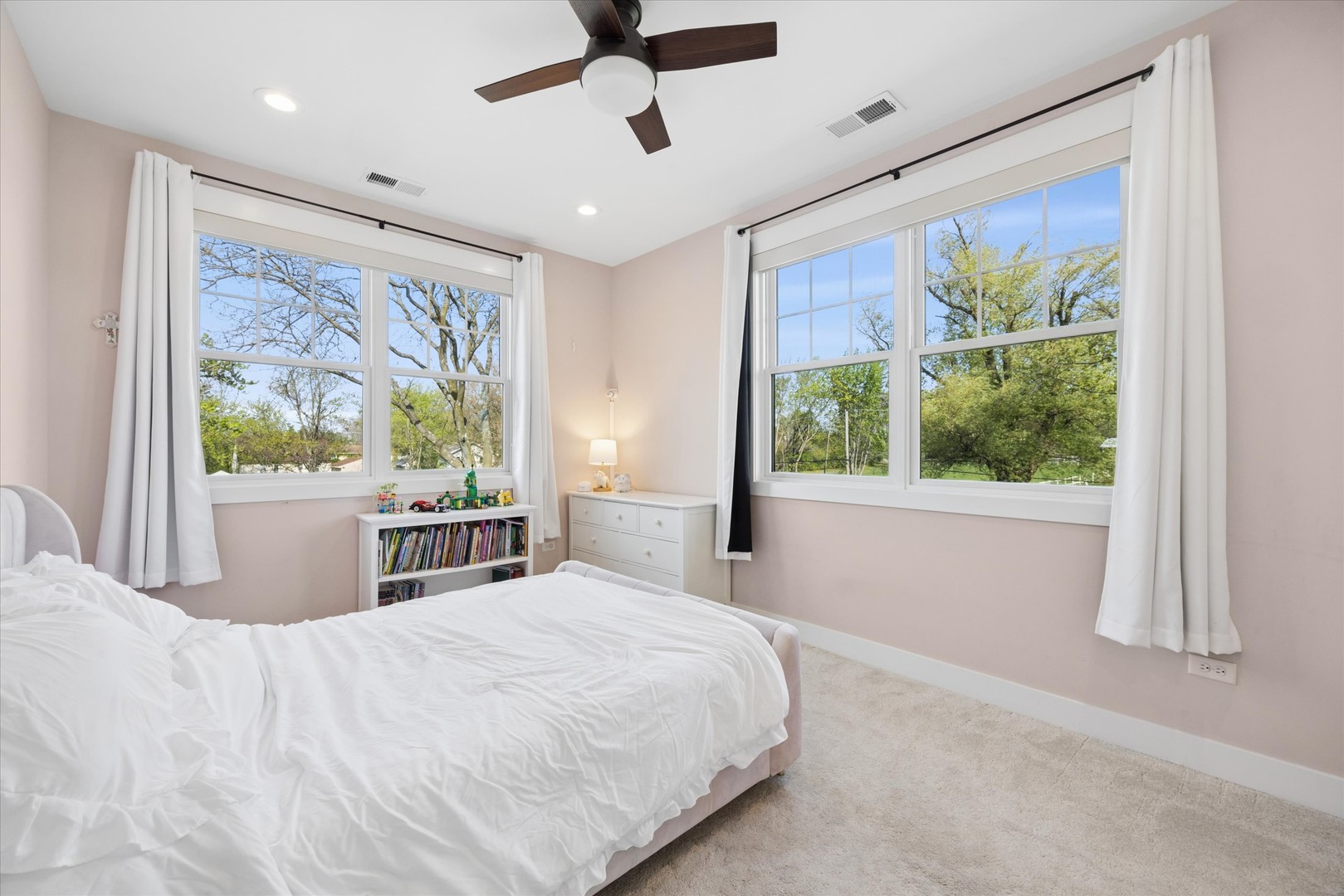 16W185 89th Street Burr Ridge, IL 60527 - Photo 28 of 44 a bedroom with a large bed and a window