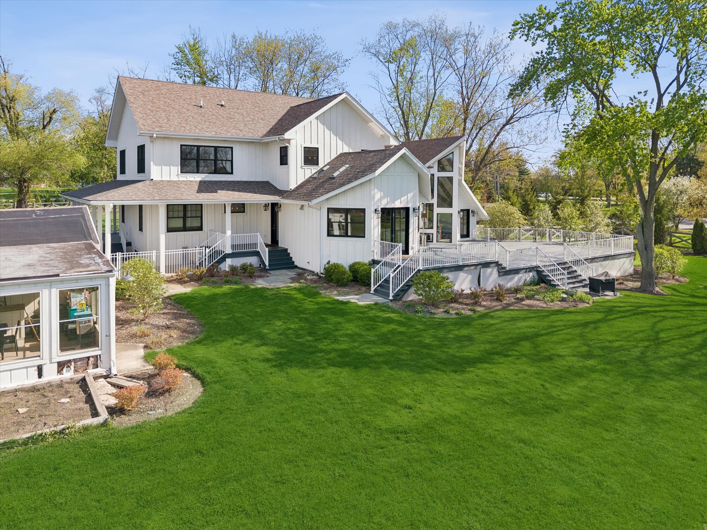 16W185 89th Street Burr Ridge, IL 60527 - Photo 34 of 44 a view of a house with a big yard potted plants and large tree