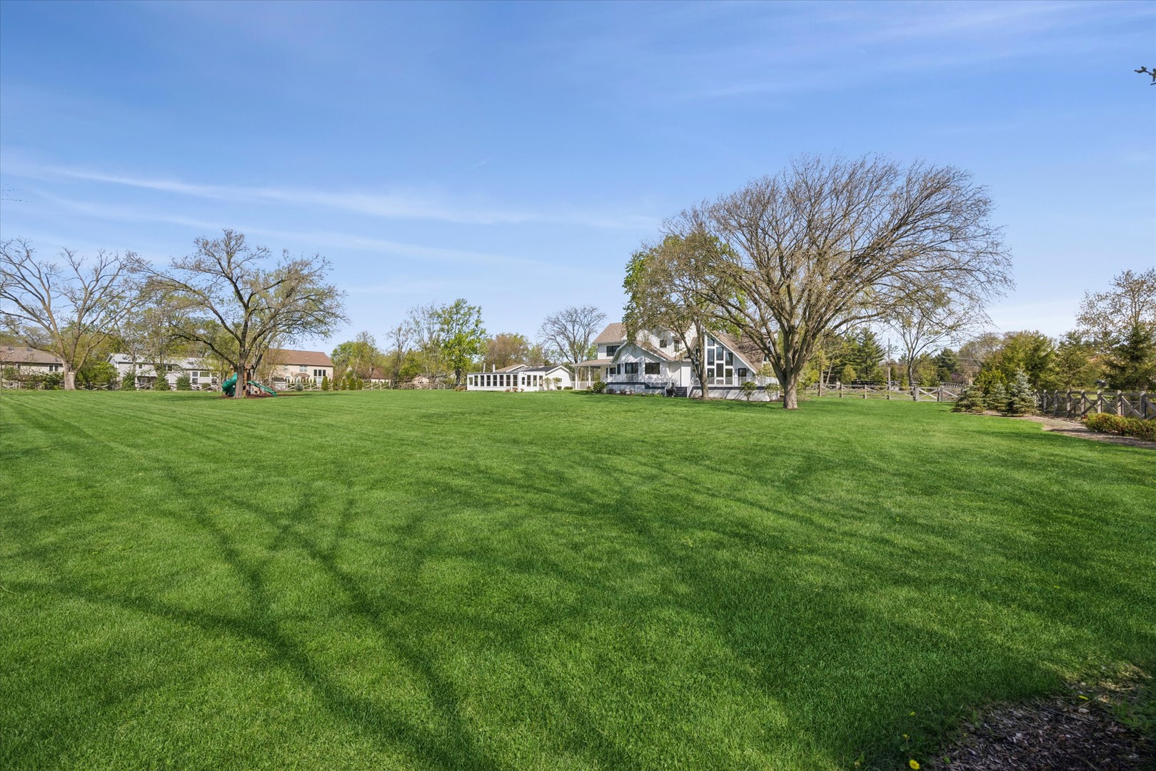 16W185 89th Street Burr Ridge, IL 60527 - Photo 37 of 44 a view of green field with trees in the background