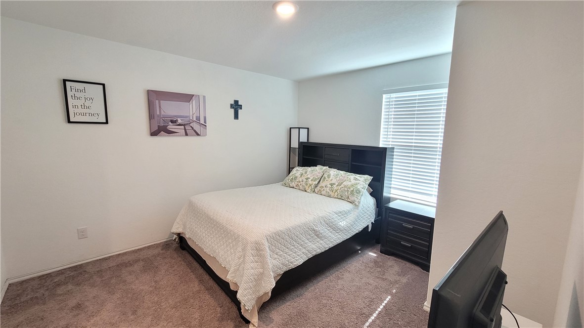 3206 Lancer Street Robstown, TX 78380 - Photo 13 of 23 a bedroom with a bed and a window