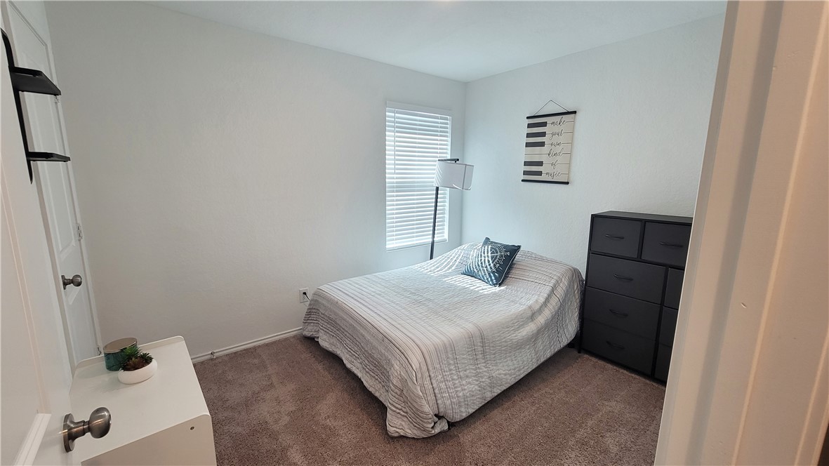 3206 Lancer Street Robstown, TX 78380 - Photo 17 of 23 a bedroom with a bed and a window