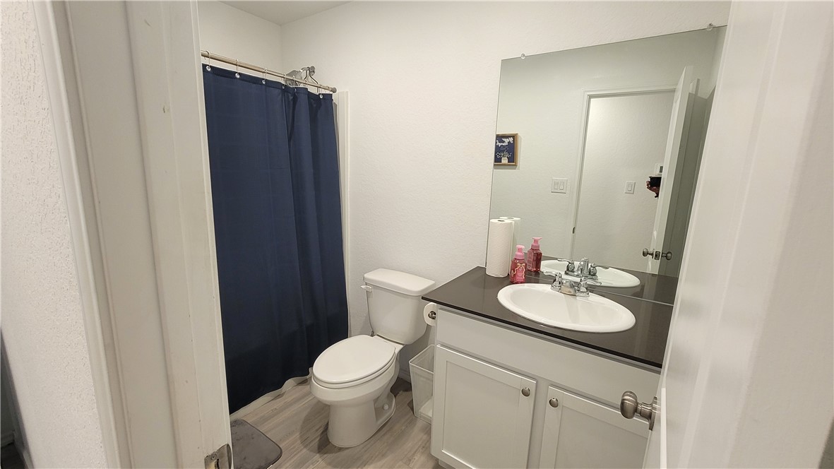 3206 Lancer Street Robstown, TX 78380 - Photo 18 of 23 a bathroom with a sink a toilet and mirror