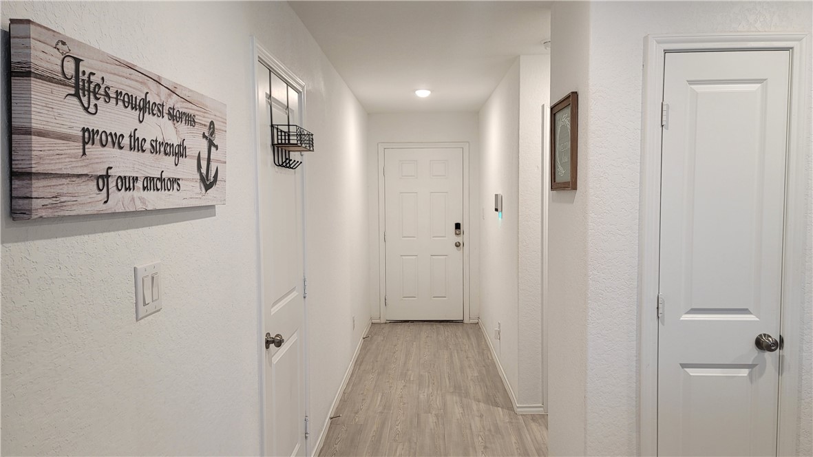 3206 Lancer Street Robstown, TX 78380 - Photo 4 of 23 a view of a hallway with a white walls