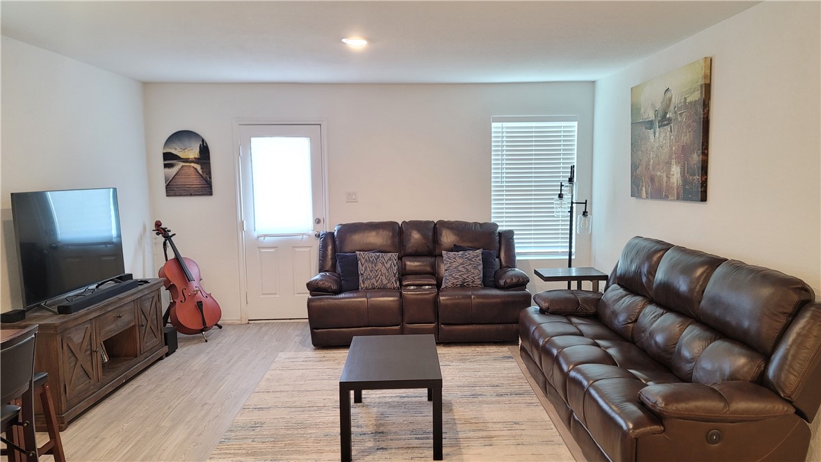 3206 Lancer Street Robstown, TX 78380 - Photo 5 of 23 a living room with furniture and a flat screen tv