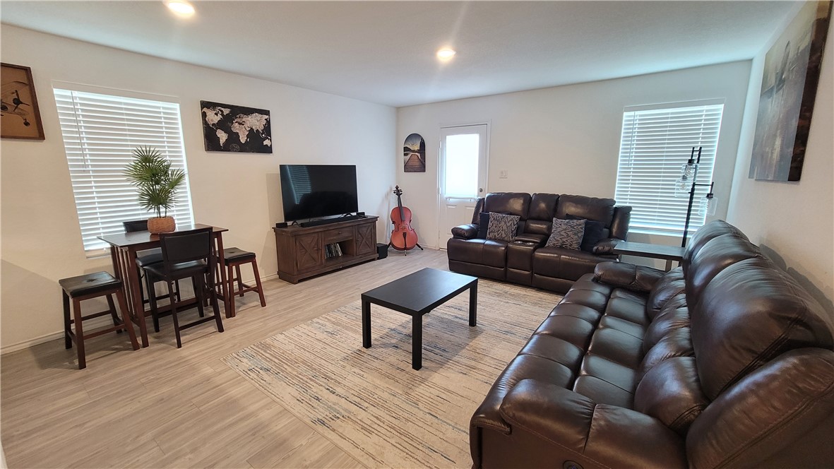 3206 Lancer Street Robstown, TX 78380 - Photo 6 of 23 a living room with furniture and a flat screen tv