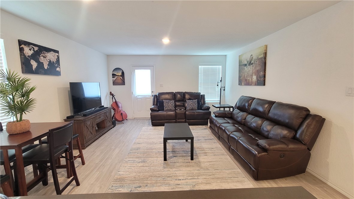 3206 Lancer Street Robstown, TX 78380 - Photo 8 of 23 a living room with furniture and a flat screen tv