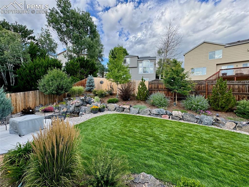 3265 Flying Horse Road Colorado Springs, CO 80922 - Photo 2 of 43 Lots of time and effort went into making this yard incredibly beautiful