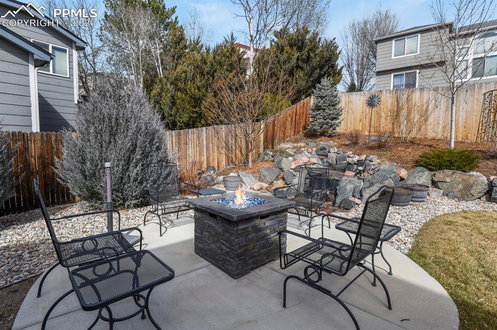 3265 Flying Horse Road Colorado Springs, CO 80922 - Photo 36 of 43 Firepit area in the beautifully landscaped backyard