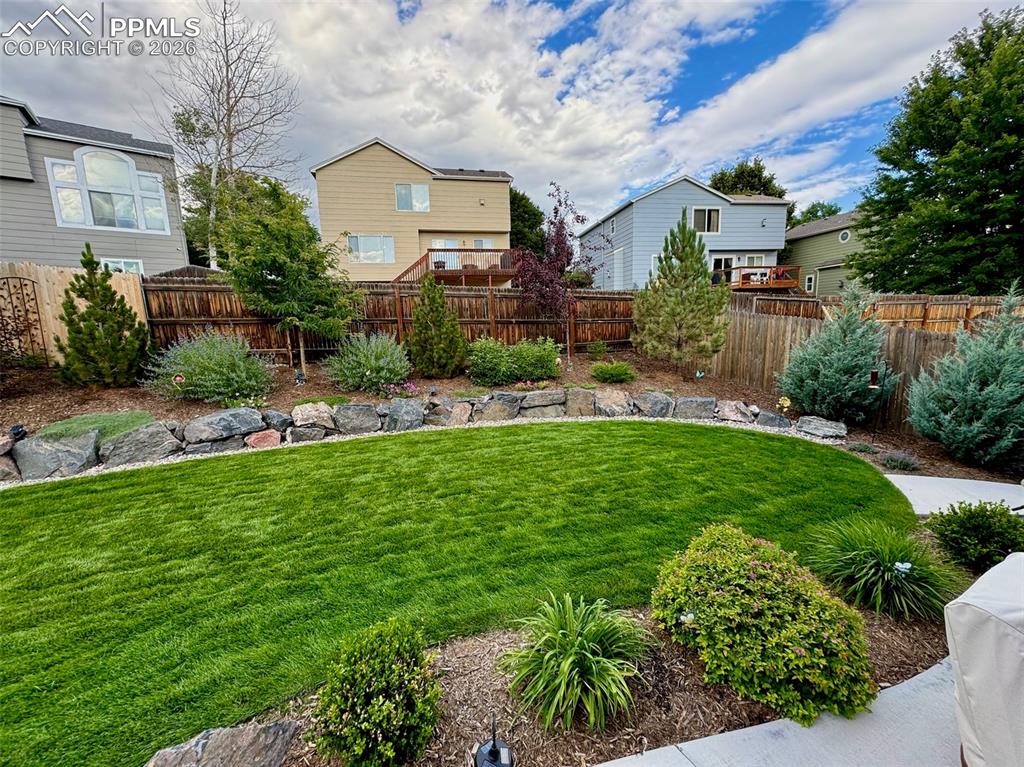3265 Flying Horse Road Colorado Springs, CO 80922 - Photo 42 of 43 Back yard just waiting for you to come sit down and enjoy