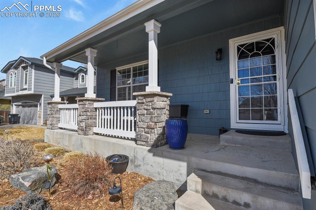 3265 Flying Horse Road Colorado Springs, CO 80922 - Photo 7 of 43 This porch is just inviting you to come inside.