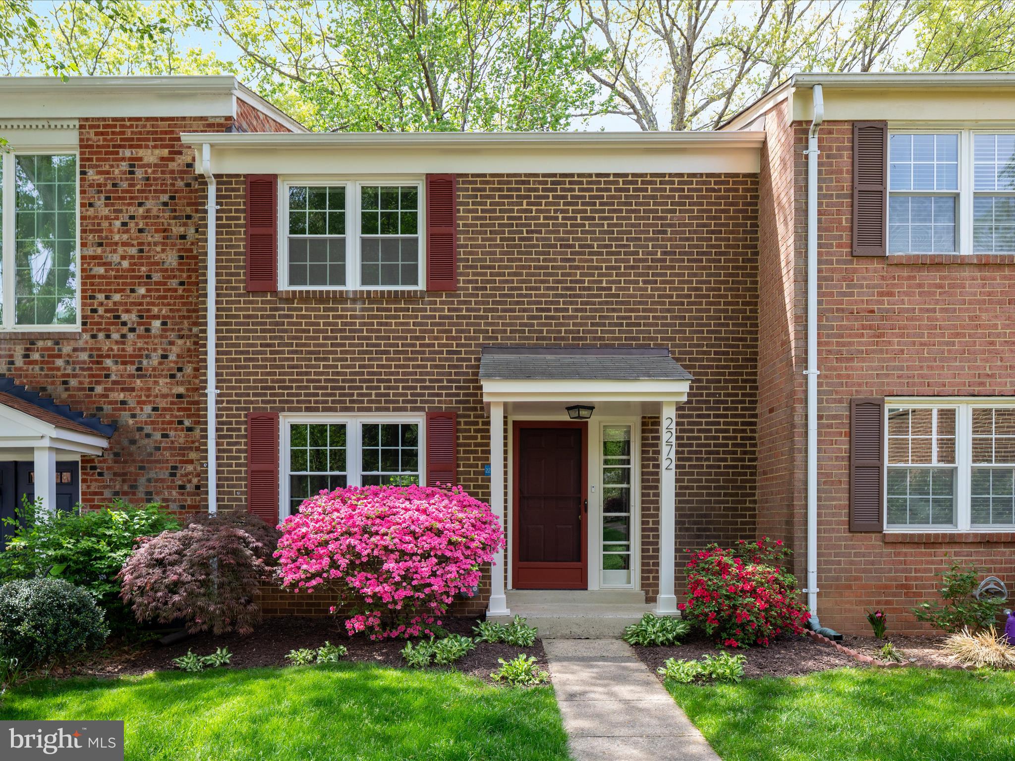 2272 Gunsmith Square Reston, VA 20191 - Photo 1 of 63 a front view of a house with garden