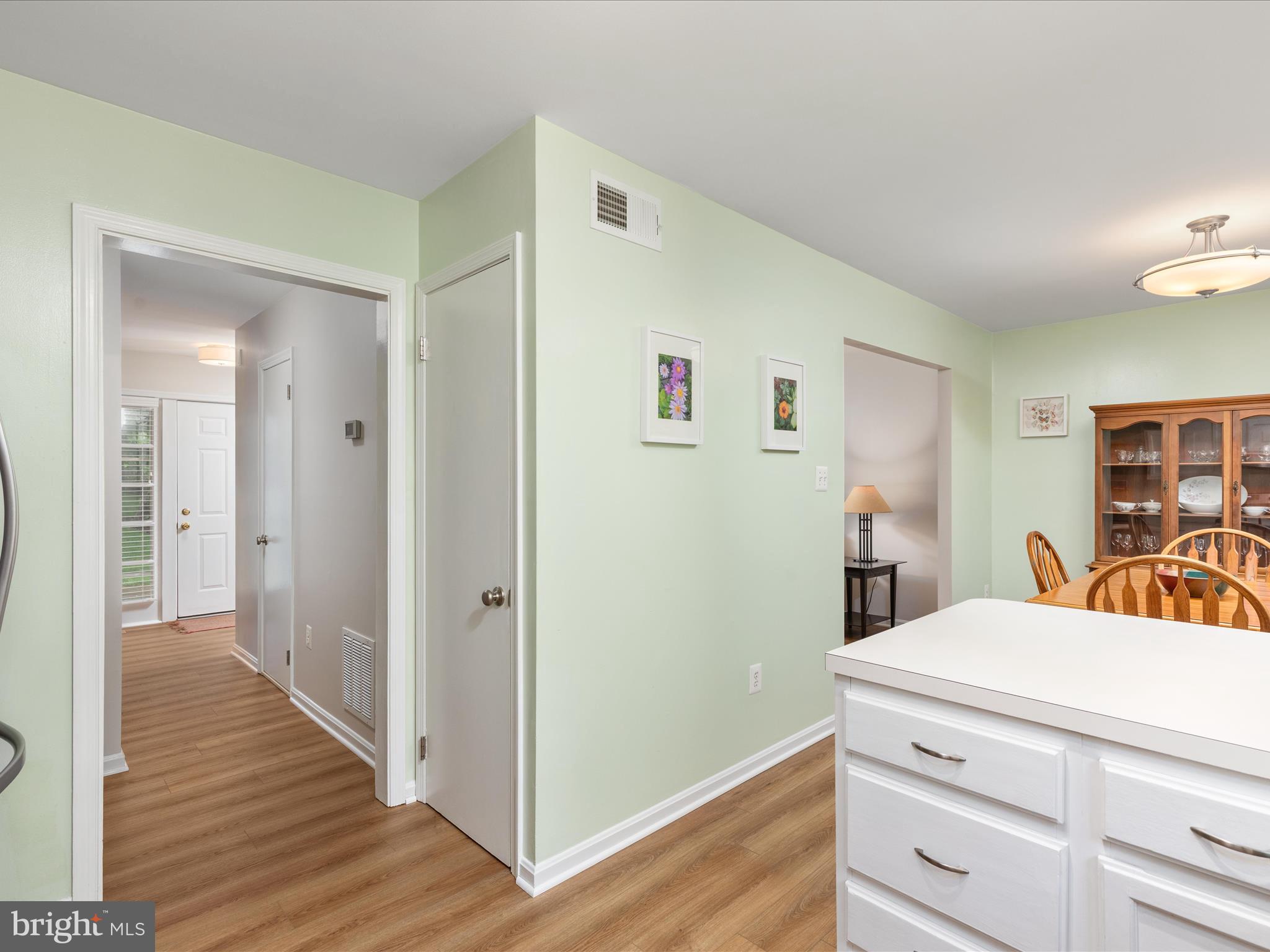 2272 Gunsmith Square Reston, VA 20191 - Photo 11 of 63 a view of a hallway to a house and wooden floor