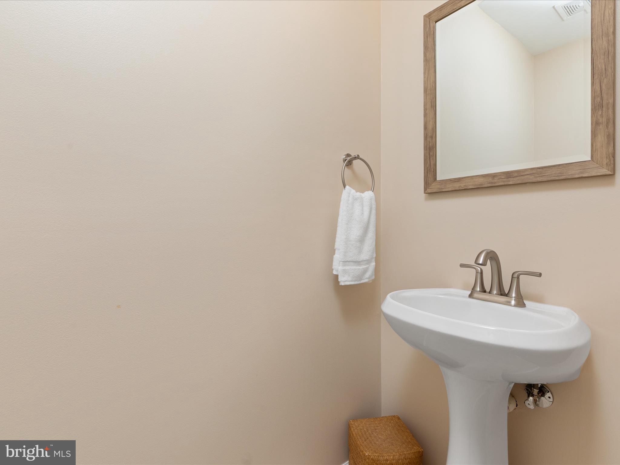 2272 Gunsmith Square Reston, VA 20191 - Photo 12 of 63 a bathroom with a sink and mirror