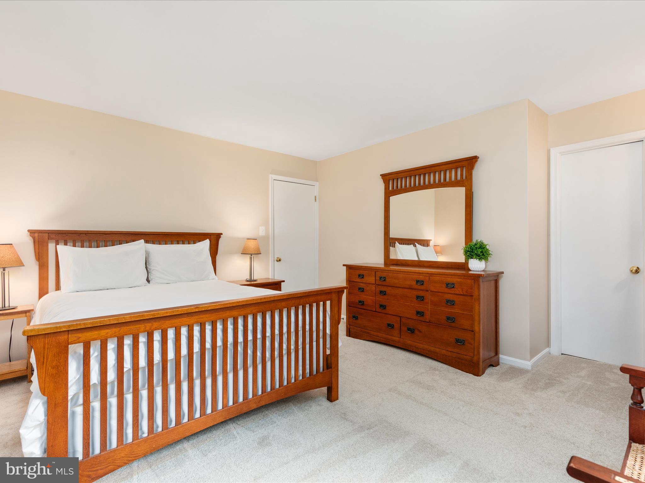 2272 Gunsmith Square Reston, VA 20191 - Photo 14 of 63 a bedroom with a bed and a dresser