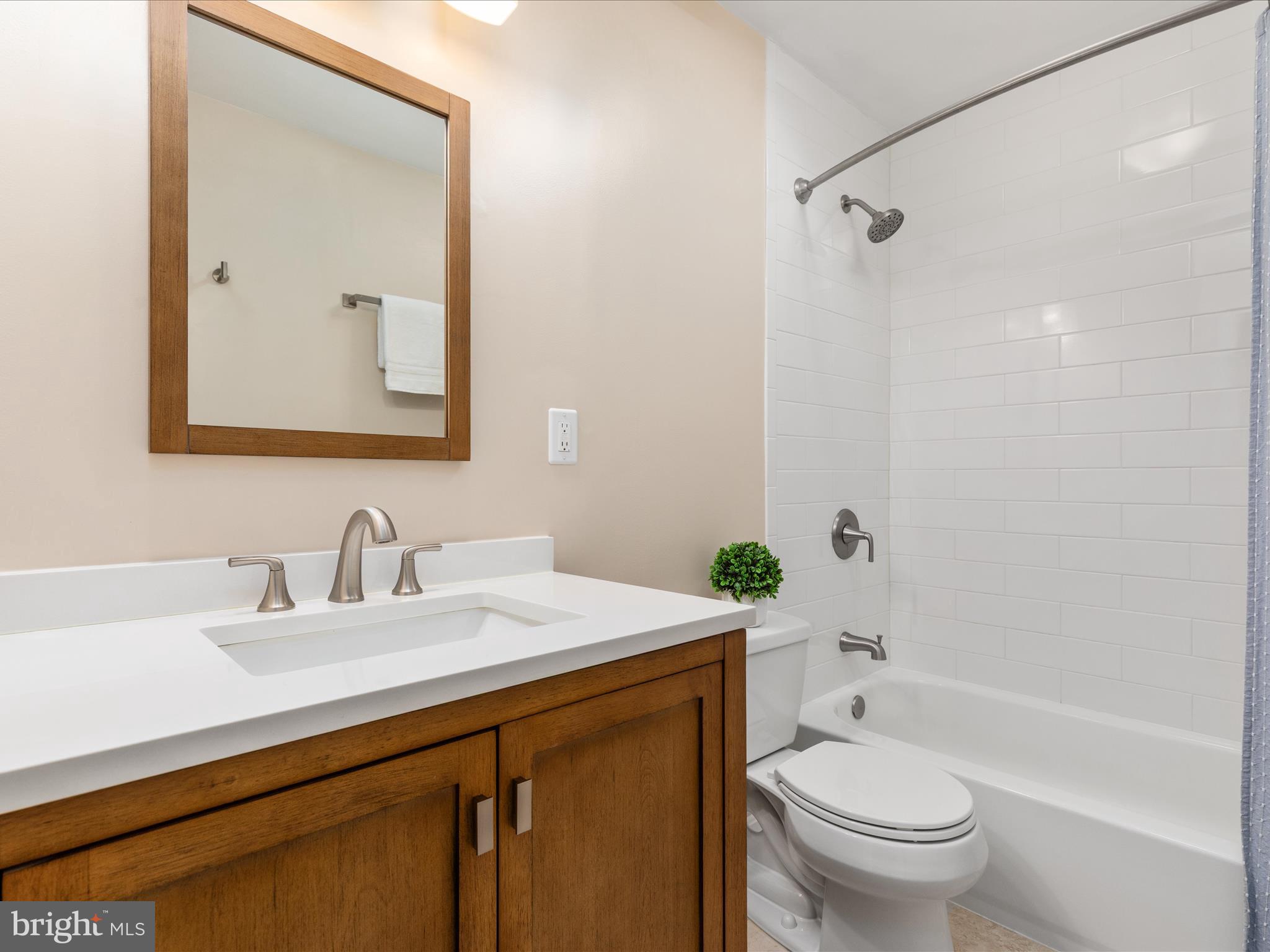 2272 Gunsmith Square Reston, VA 20191 - Photo 17 of 63 a bathroom with a sink vanity mirror and toilet