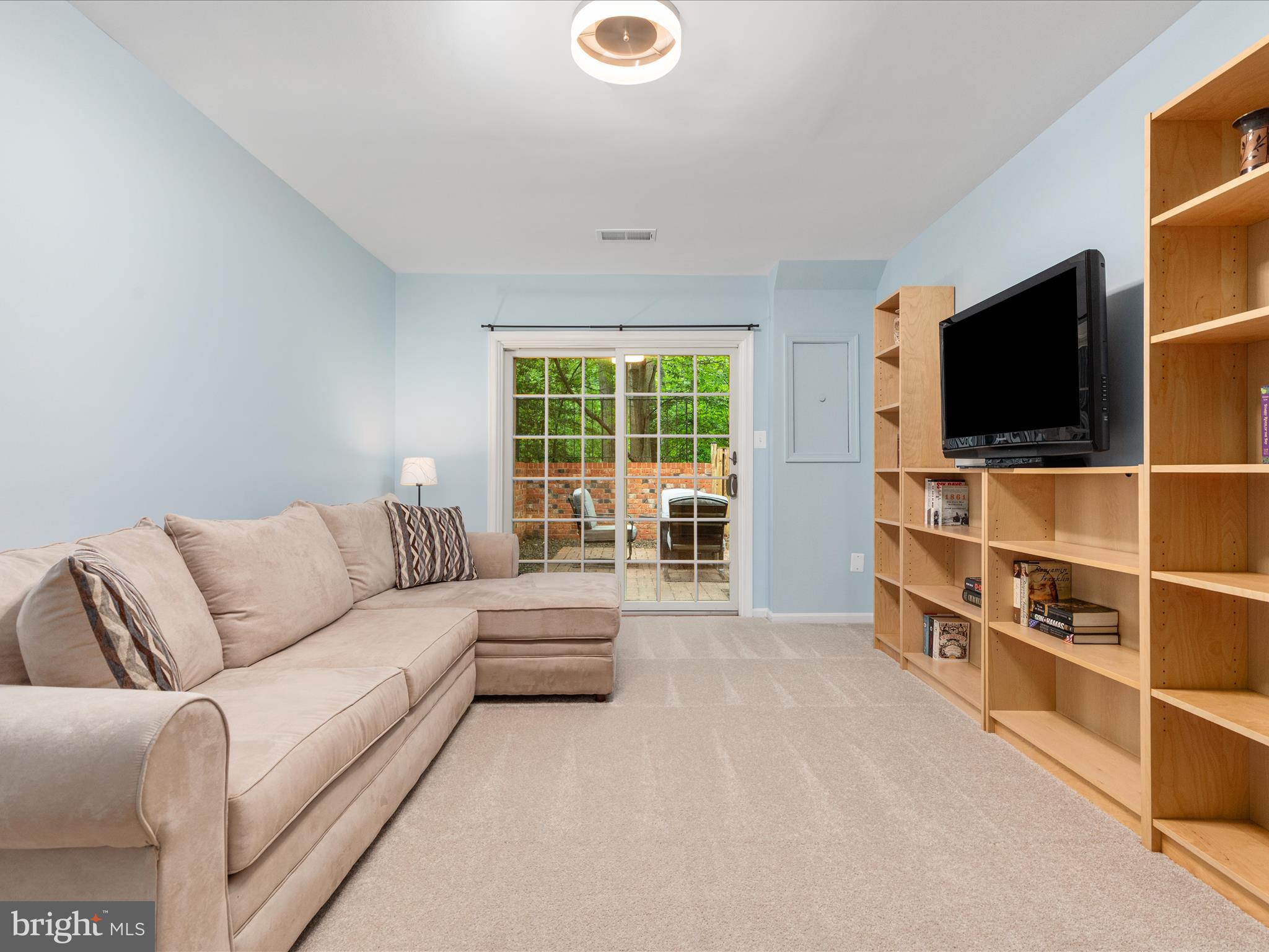 2272 Gunsmith Square Reston, VA 20191 - Photo 18 of 63 a living room with furniture and a flat screen tv