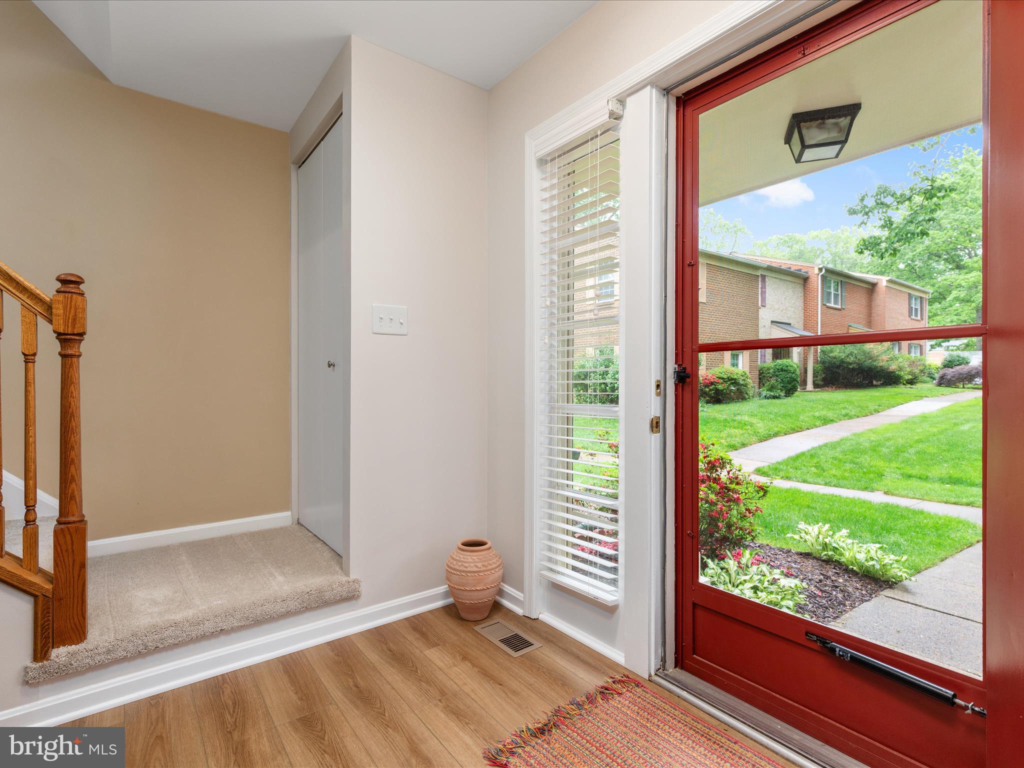2272 Gunsmith Square Reston, VA 20191 - Photo 2 of 63 a view of an entryway with a garden