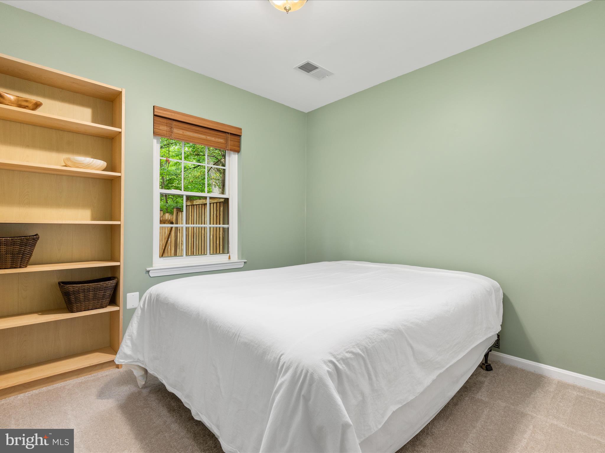 2272 Gunsmith Square Reston, VA 20191 - Photo 21 of 63 a large bed sitting in a bedroom next to a window