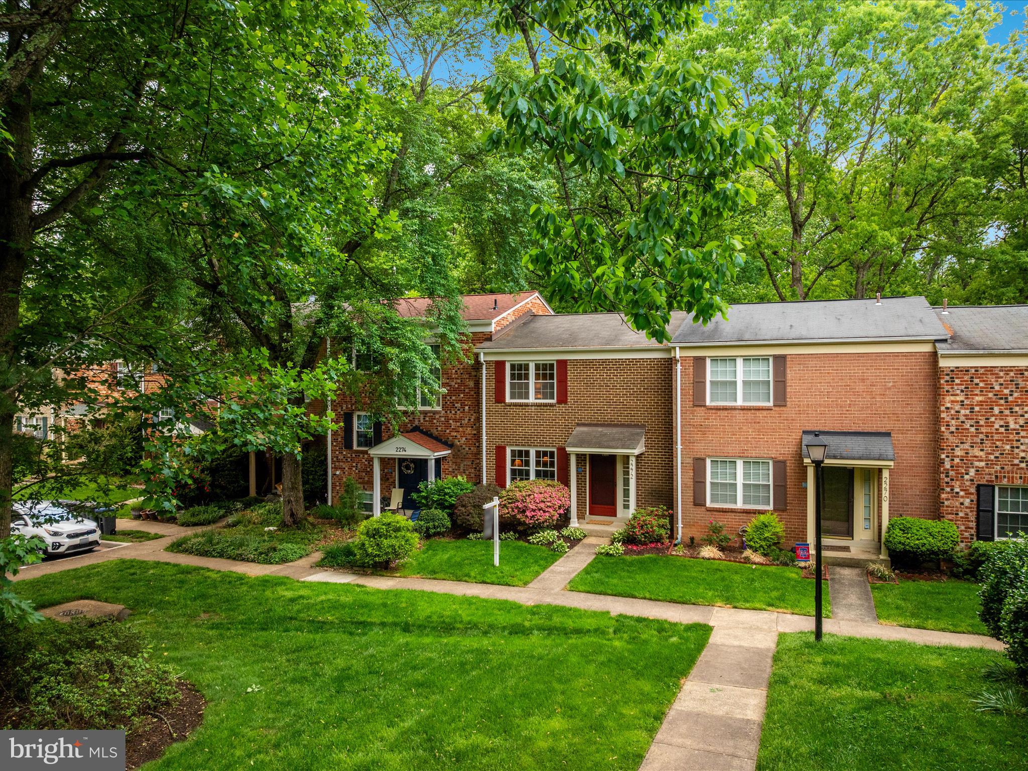 2272 Gunsmith Square Reston, VA 20191 - Photo 25 of 63 a front view of a house with a yard