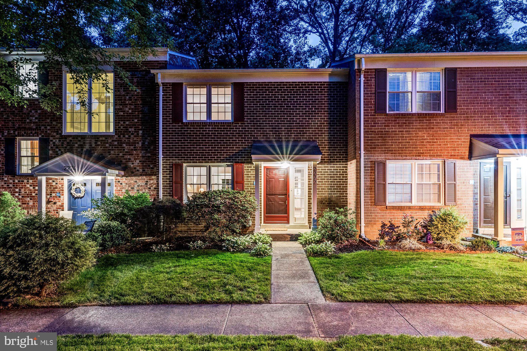 2272 Gunsmith Square Reston, VA 20191 - Photo 26 of 63 a front view of a house with garden