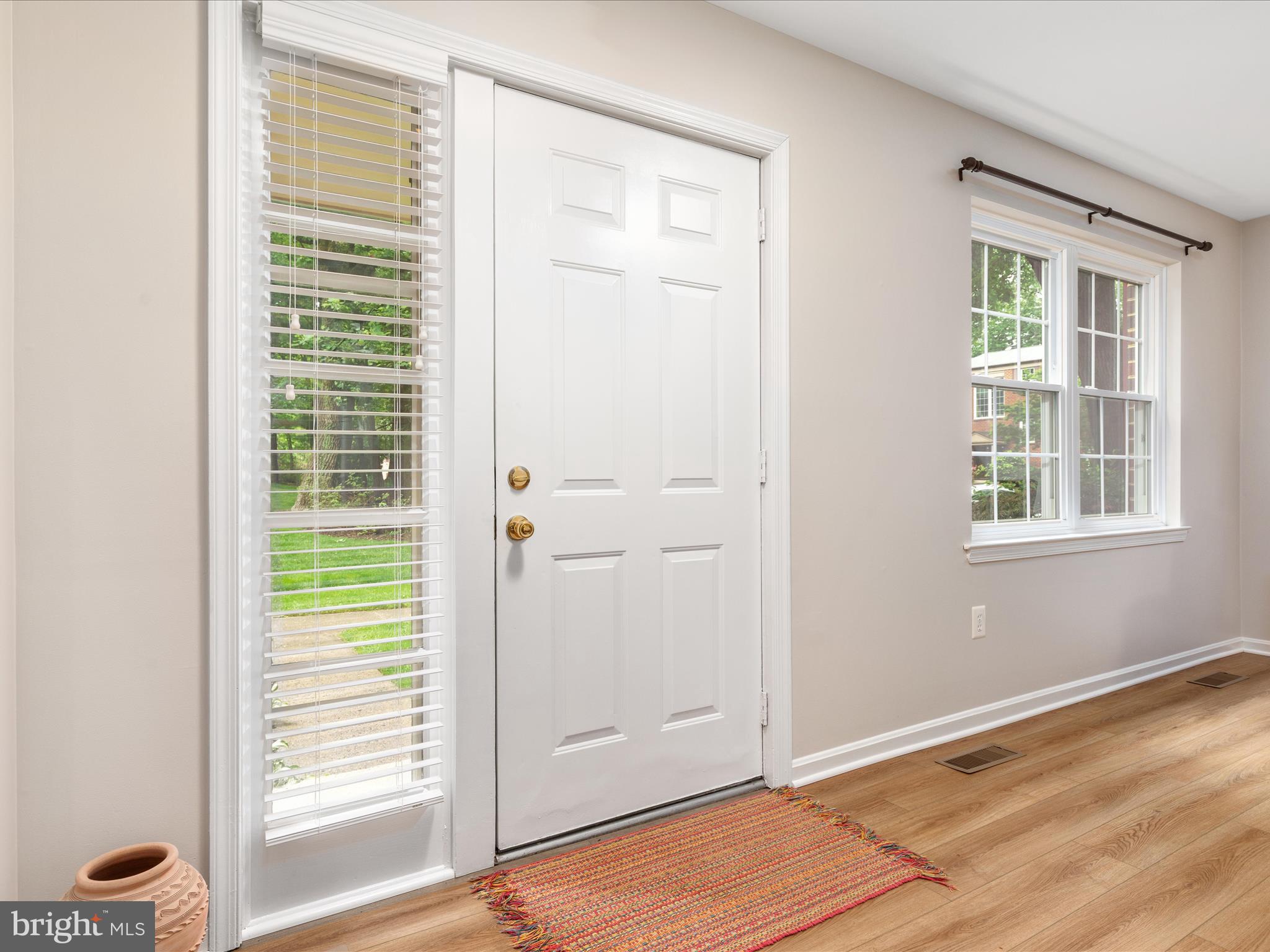 2272 Gunsmith Square Reston, VA 20191 - Photo 3 of 63 a view of an empty room with a window and wooden floor