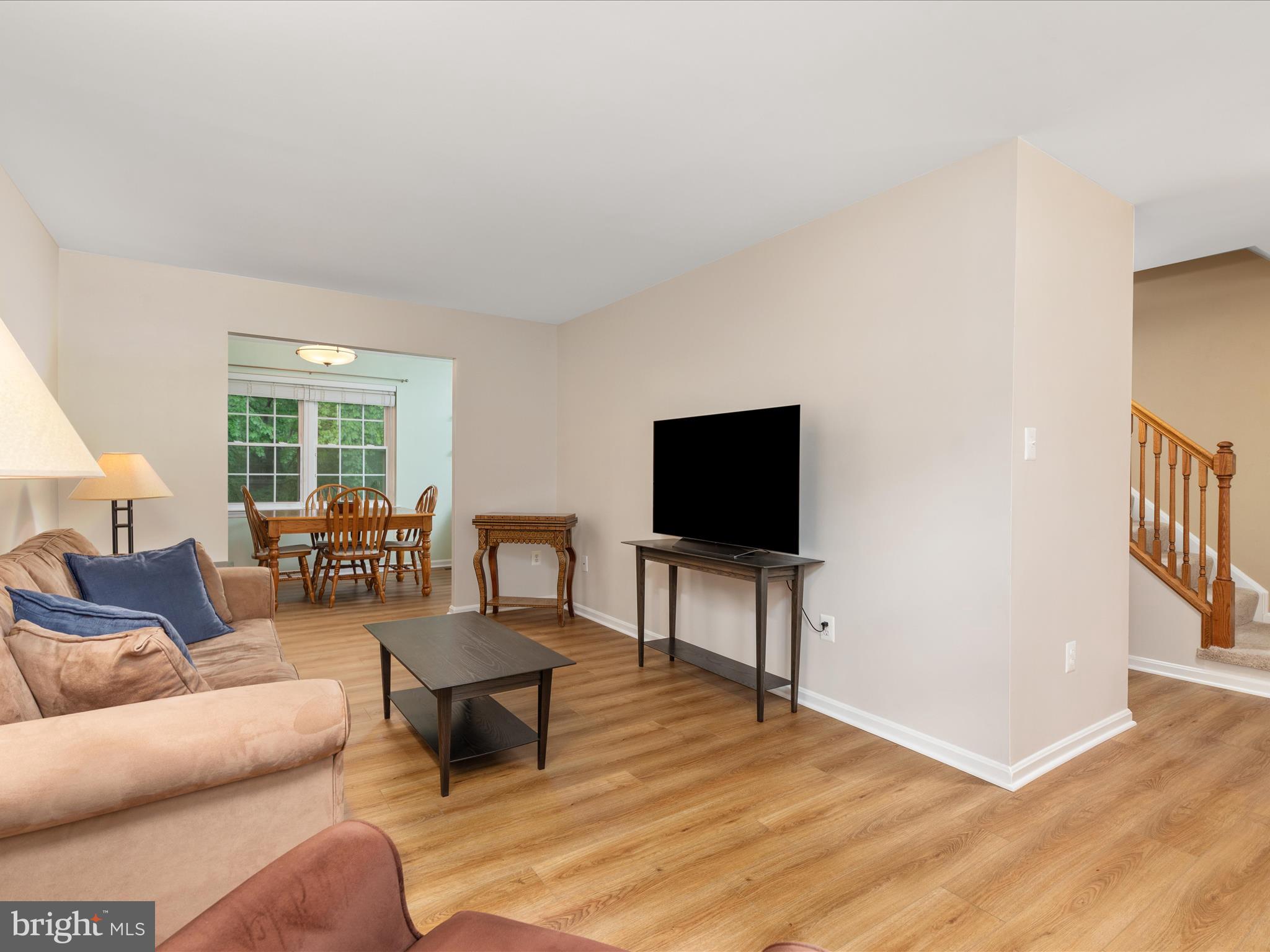2272 Gunsmith Square Reston, VA 20191 - Photo 4 of 63 a living room with furniture and a flat screen tv