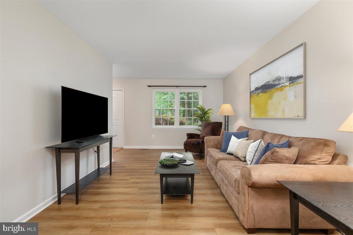 2272 Gunsmith Square Reston, VA 20191 - Photo 6 of 63 a living room with furniture and a flat screen tv