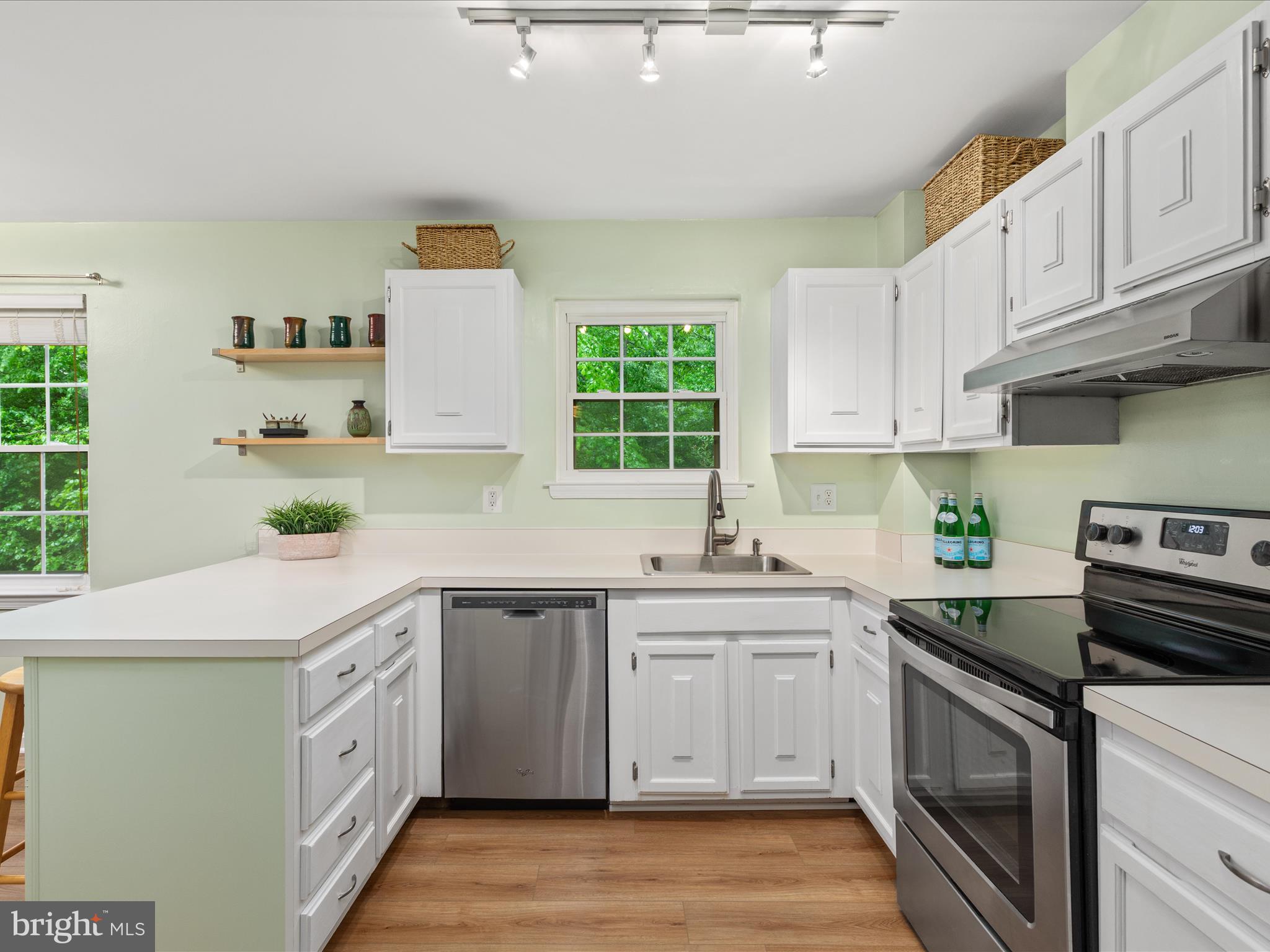 2272 Gunsmith Square Reston, VA 20191 - Photo 10 of 63 a kitchen with a sink stove and cabinets