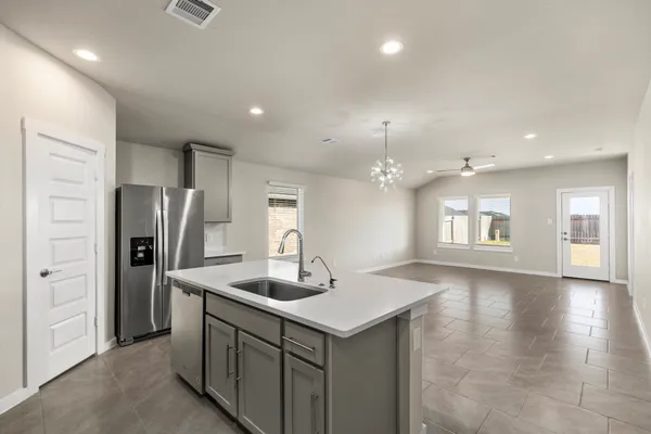 a kitchen with refrigerator and window