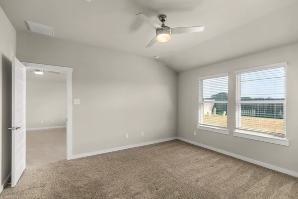 a view of an empty room with a window