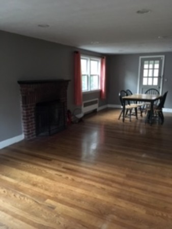 22 Crehore Road Boston, MA 02467 - Photo 5 of 9 a living room with furniture and a fireplace