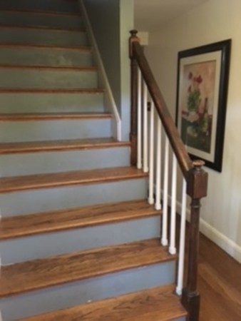22 Crehore Road Boston, MA 02467 - Photo 7 of 9 a view of staircase with wooden floor and a view of a house