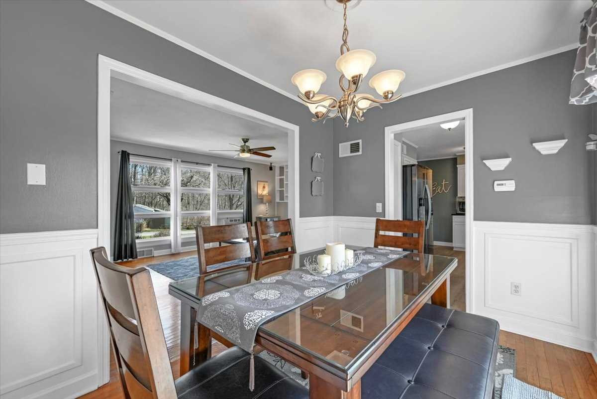 6 Broadview Road Poughkeepsie, NY 12603 - Photo 12 of 35 a view of a dining room with furniture wooden floor and chandelier