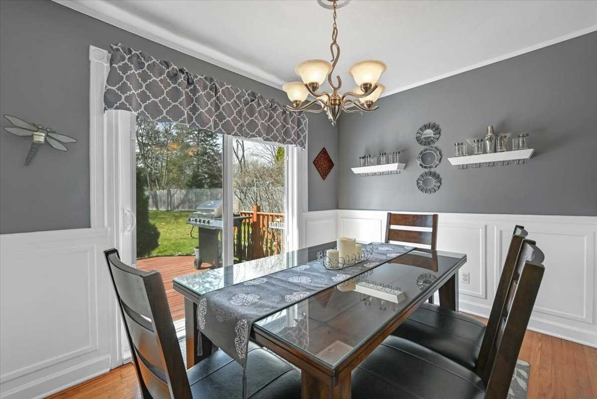 6 Broadview Road Poughkeepsie, NY 12603 - Photo 13 of 35 a view of a dining room with furniture a chandelier and wooden floor