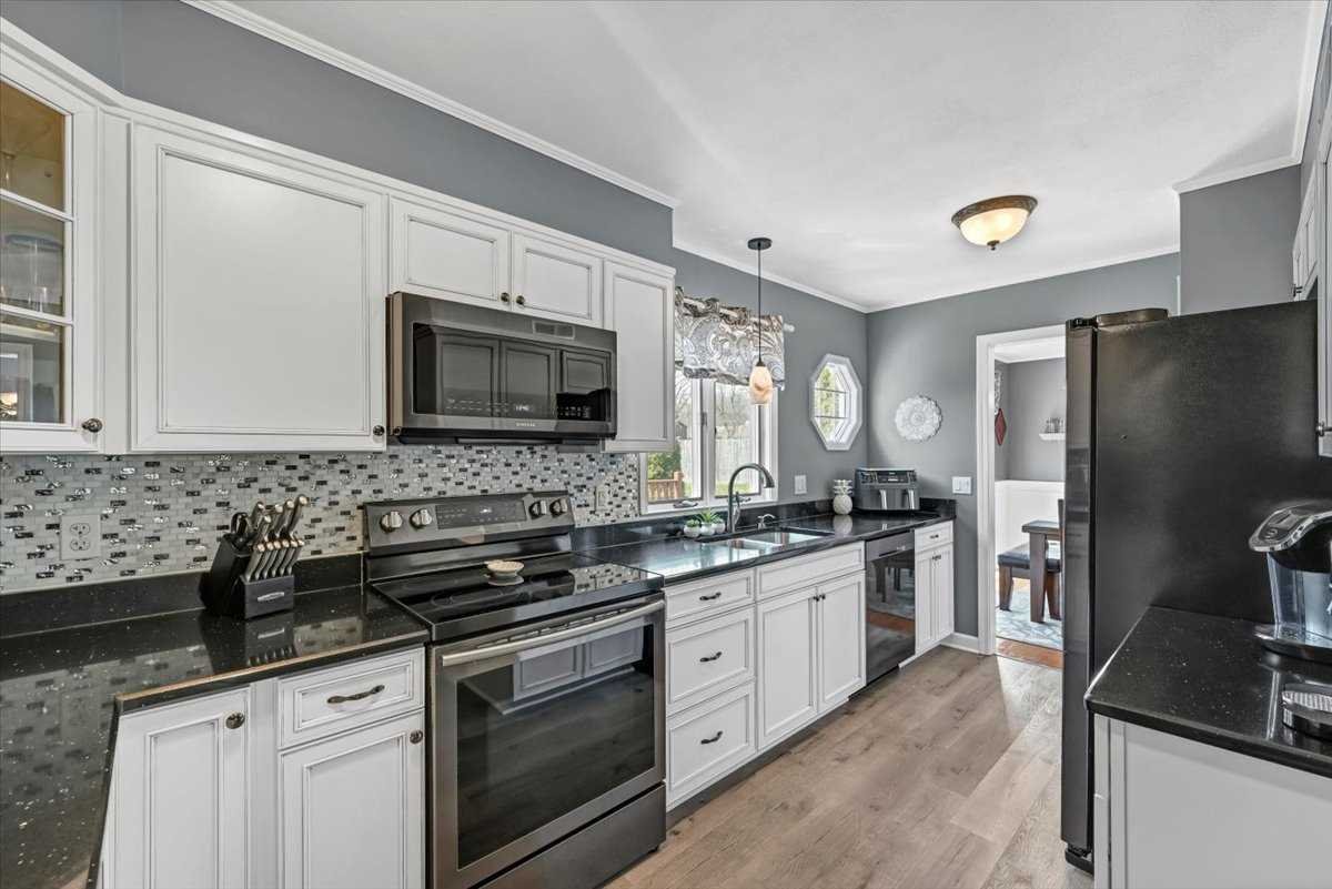 6 Broadview Road Poughkeepsie, NY 12603 - Photo 16 of 35 a kitchen with stainless steel appliances a stove sink microwave and refrigerator